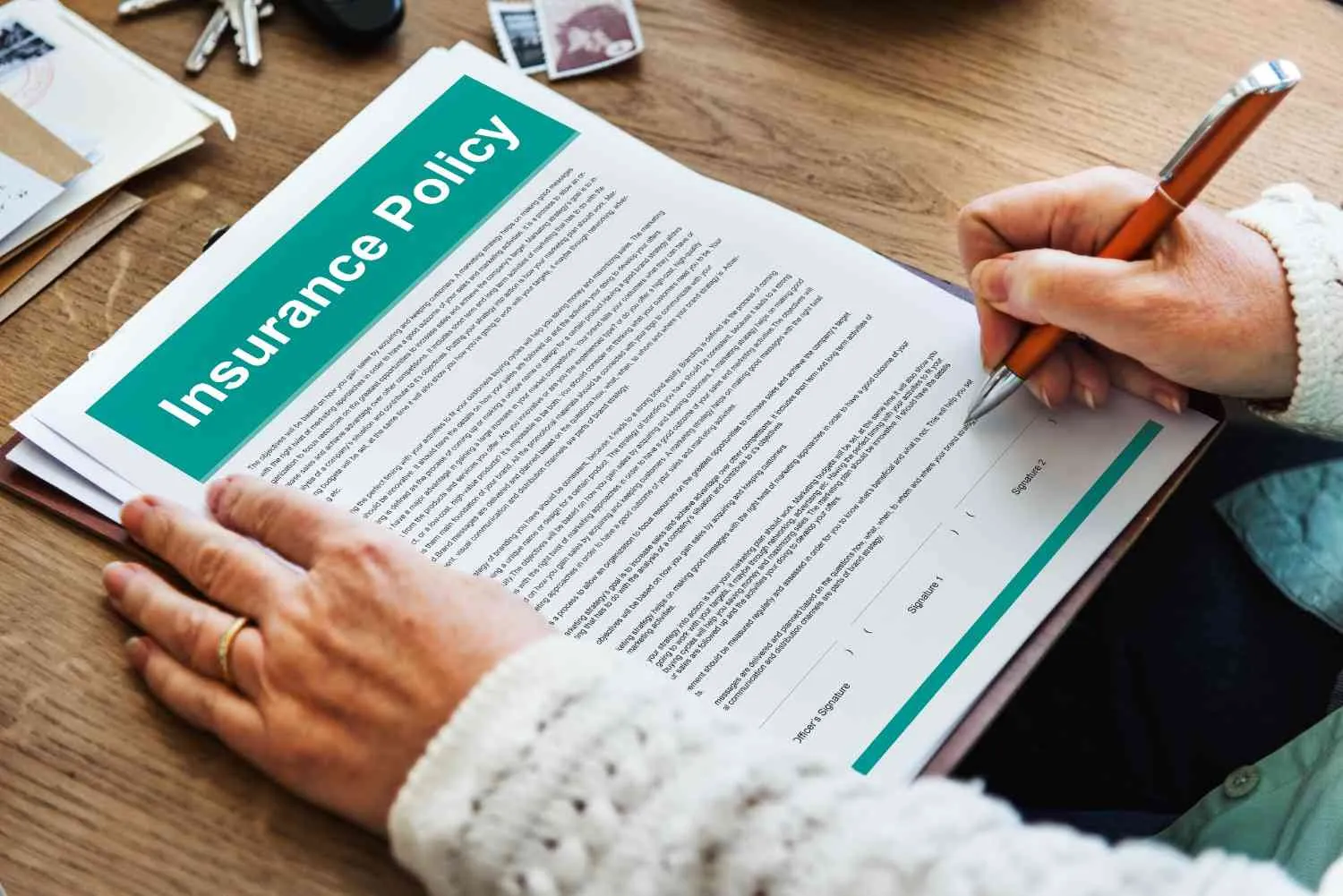 A person reading through an insurance policy document